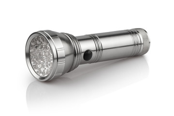 Close-up of a flashlight, isolated on white background