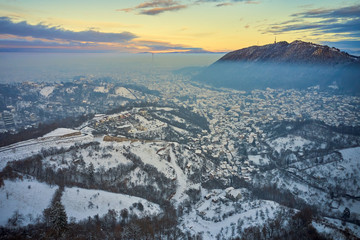 Brasov, Transylvania. Romania. Panoramic view of the old town and Council Square in the winter time, Aerial cityscape of Brasov city, Transylvania landmark in Romania