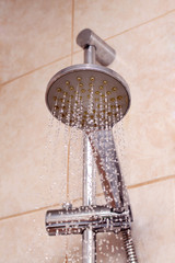Shower head on fastener with dripping water drops