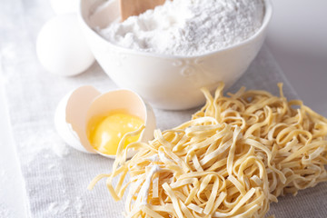 flour, noodles and raw chicken eggs close-up.