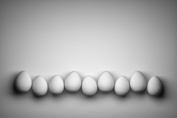 Many small white easter eggs arranged in a row on white background. Image with copy blank space. 3d illustration.