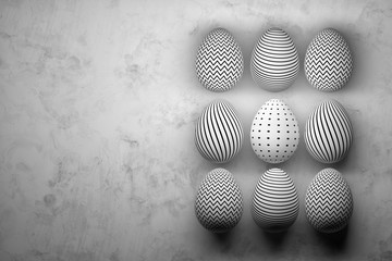 Nine easter eggs with geometric patterns - lines, dots, zigzag lines. Monochrome greeting card with copy blank space on the left. 3d illustration.