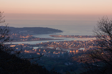 Obraz premium Look from Bidasoa-Txingudi bay with Irun, Hondarribia and Hendaia, at the Basque Country.