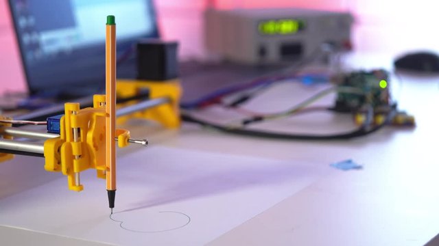 Plotter draws abstract calligraphic patterns
