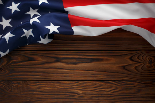American flag on dark wooden board