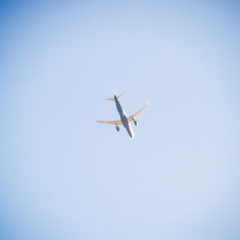 Passenger aircraft in the sky at low altitude flies to the airpo