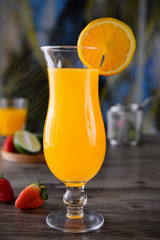 Freshly squeezed orange juice in a transparent glass