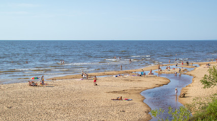 Uncrowded summer beach on the shores of the cold Baltic Sea.