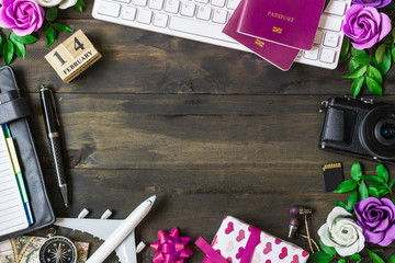 Valentine's Travel Plan concept. Pc keyboard, passport, camera, sd card, usb devices, notebook,...