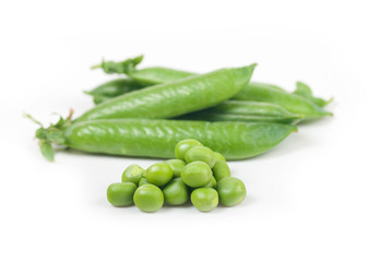 green peas in pods on a white background