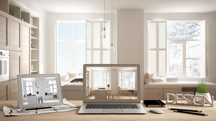 Architect designer desktop concept, laptop and tablet on wooden desk with screen showing interior design project and CAD sketch, blurred draft in the background, modern white kitchen