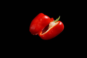 sweet pepper in a cut isolated on a black background