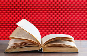 detailed book on a brick wall background