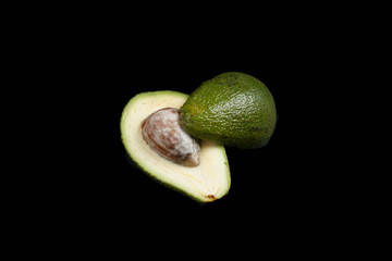 avocado in cut isolated on black background
