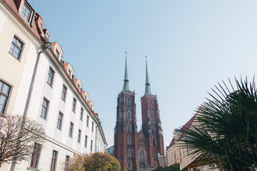 Fototapeta na wymiar Beautiful Catholic church in Europe against the blue sky