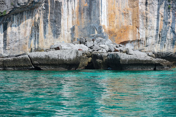 natural famous Phi phi island with reflection light from blue sea water.