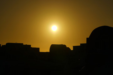 Beautiful sunset on the quaint town of Oia, Santorini