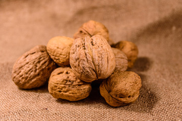 Heap of the walnuts on a sackcloth