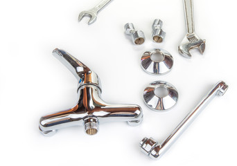 New water faucet on a white.