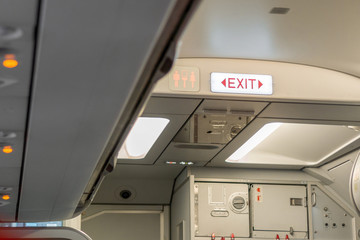 Fototapeta premium Fire exit sign on airplane, Selective focus.