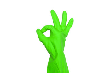 Female hand in green rubber glove shows ok sign, isolated on white