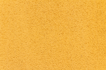 Yellow paint texture of old building wall