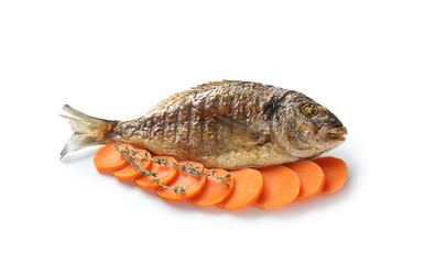Grilled dorado fish with carrot on white background