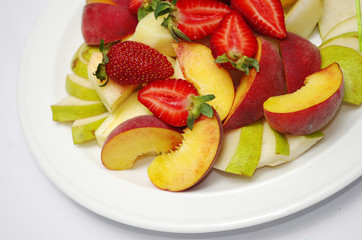 Fototapeta na wymiar Fruit and berry mix. Strawberries, Kiwis, Apples, Pears