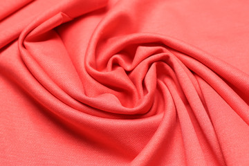 Coral fabric with folds, closeup