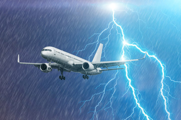 Airplane approach at the airport landing in bad weather storm hurricane rain llightning strike