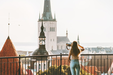 Young woman traveling in Tallinn city vacations in Estonia weekend Lifestyle outdoor girl tourist...