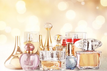 Aromatic Perfume bottles on background