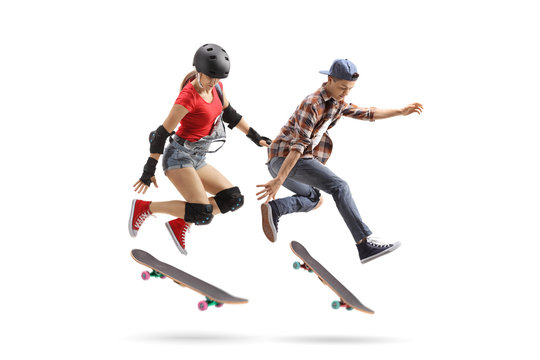 Female and male skaters performing a trick with a skateboard