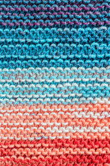 Fototapeta na wymiar striped colorful wool texture handmade closeup horizontally