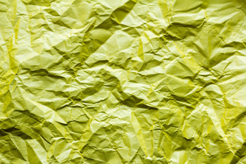 background, texture of crumpled yellow paper