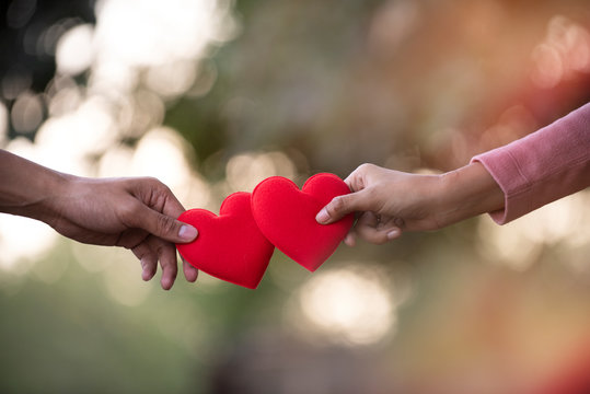 couple in love holding red  heart