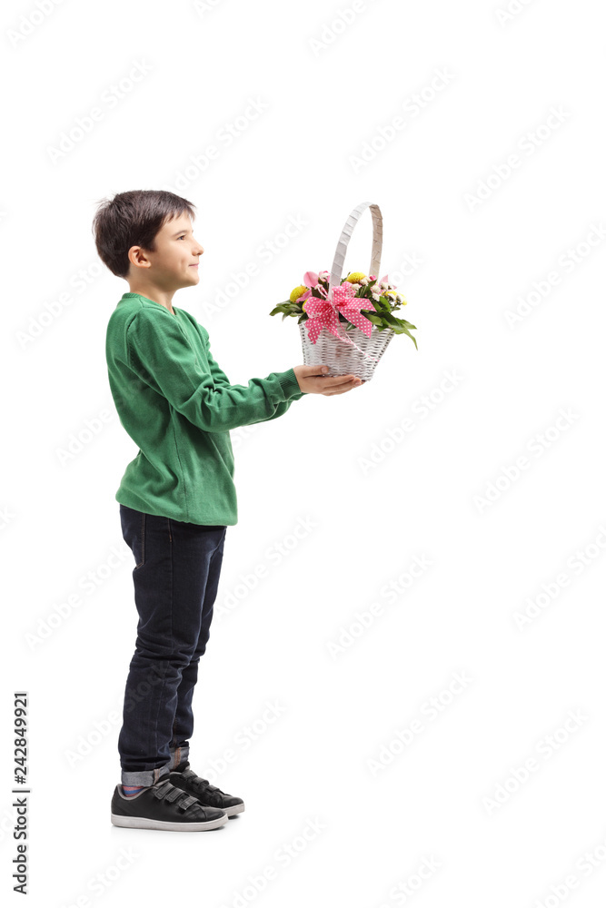 Wall mural Young boy giving a basket with flowers