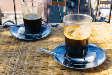 Arabian coffee with spices in Marrakesh medina. Cardamom Ramadan coffee in the oriental market