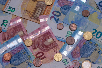 European money under a magnifying glass.