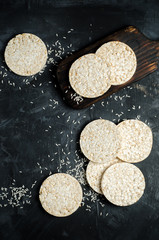 Rice cakes on black background with space for text