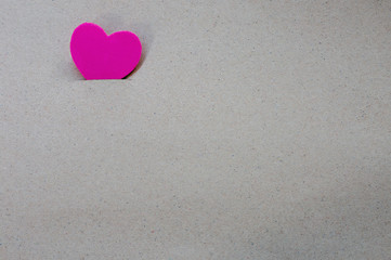 Red heart on paper background