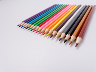 colored pencils sharpened on a white background.
