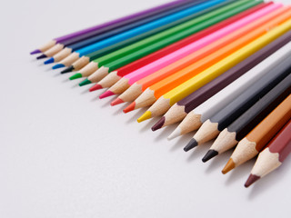 colored pencils sharpened on a white background.