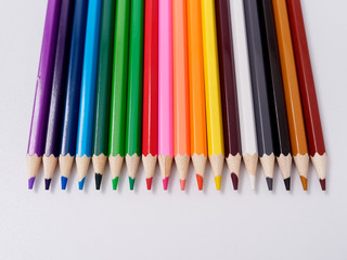 colored pencils sharpened on a white background.