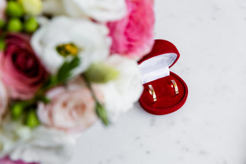 Wedding rings in a red velvet jewelry box