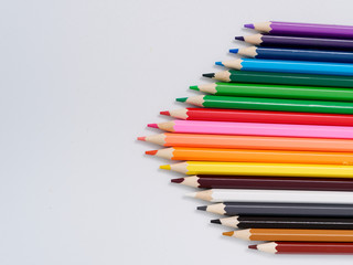 colored pencils sharpened on a white background.