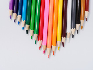 colored pencils sharpened on a white background.