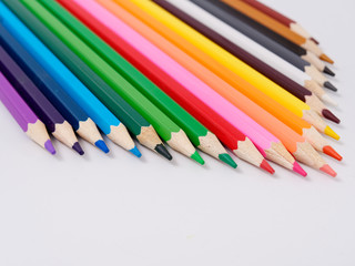 colored pencils sharpened on a white background.
