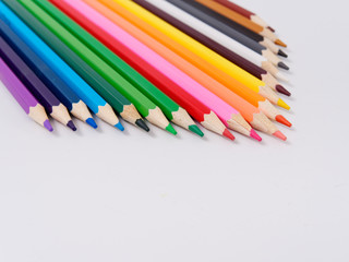 colored pencils sharpened on a white background.