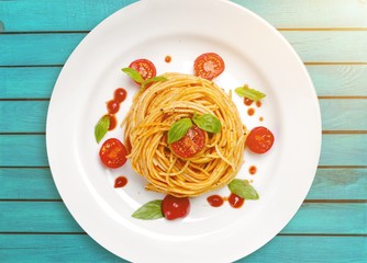 Delicious pasta on white plate on  background